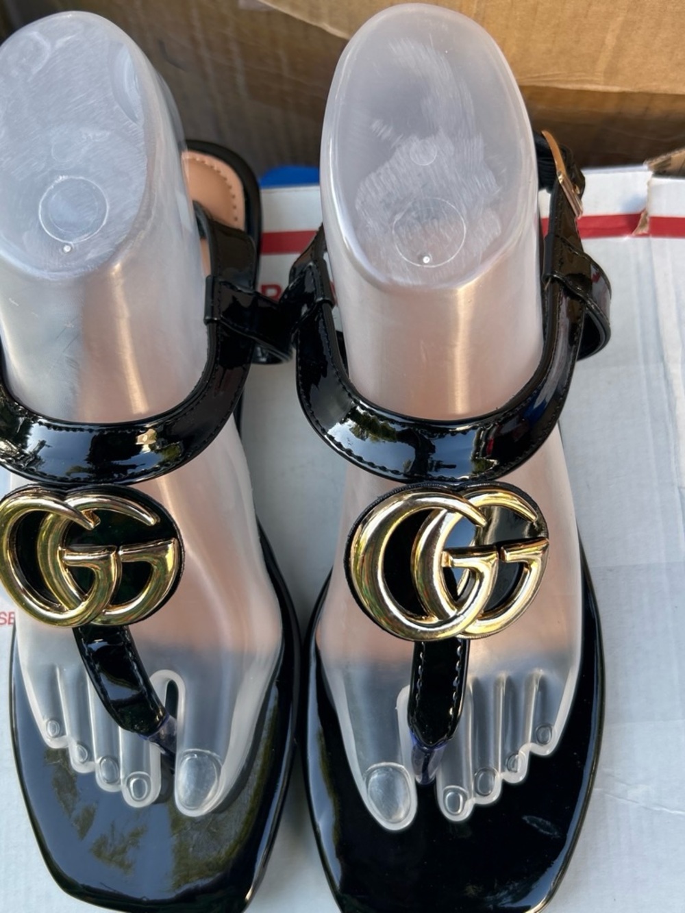 Women's Black Patent Thong Sandals with Gold Interlocking Emblem